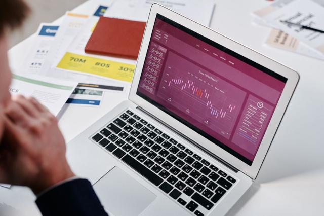 Reviewing analytics on a laptop